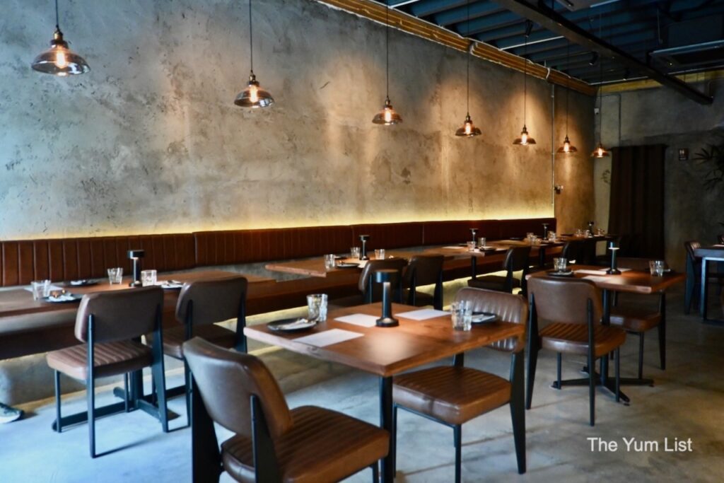 Interior of Khaosan Tapas Bar on Campbell Street, George Town Penang — dark wood and heritage shophouse setting